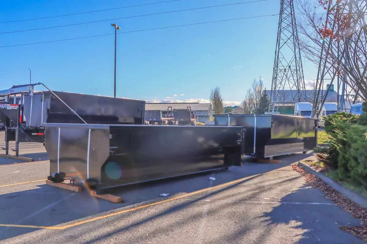 Roll-off dumpster ready for waste disposal at job site for 15 Yard Dumpster Rental in Hampden